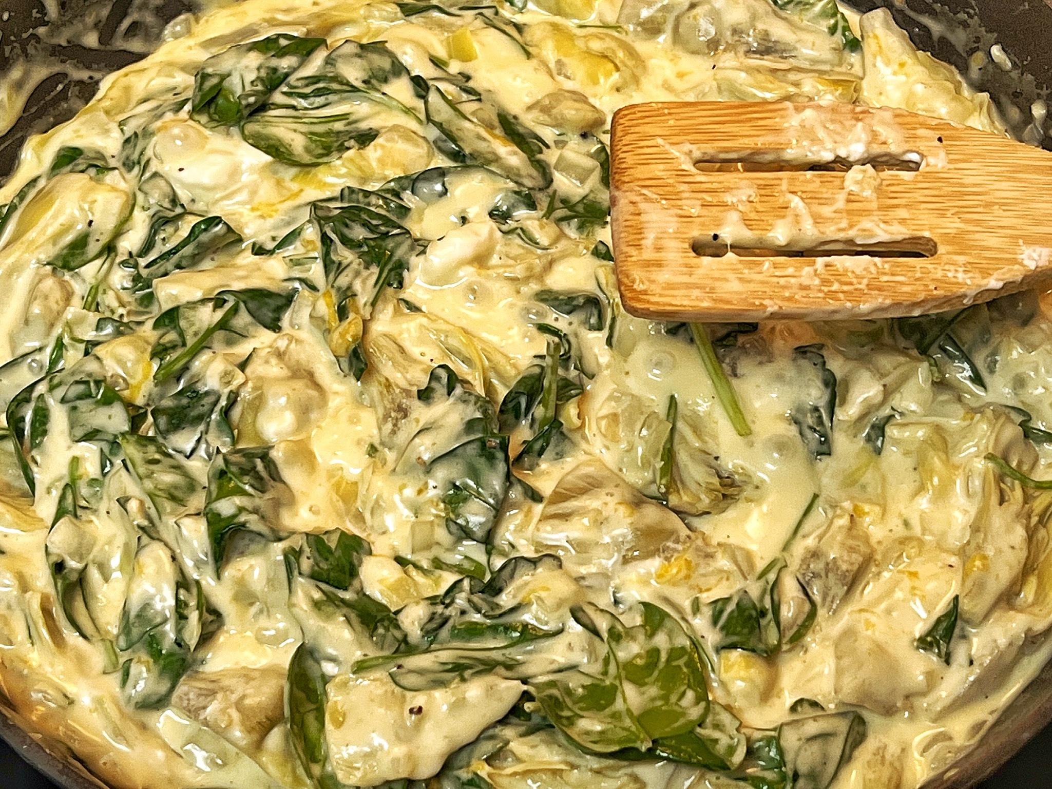 Vegan spinach artichoke dip cooking