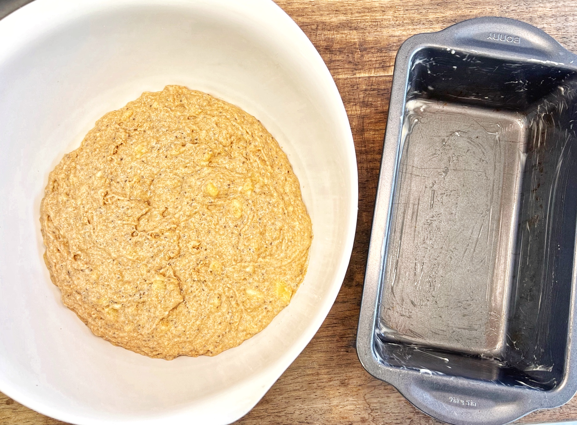 Vegan banana bread batter with greased pan