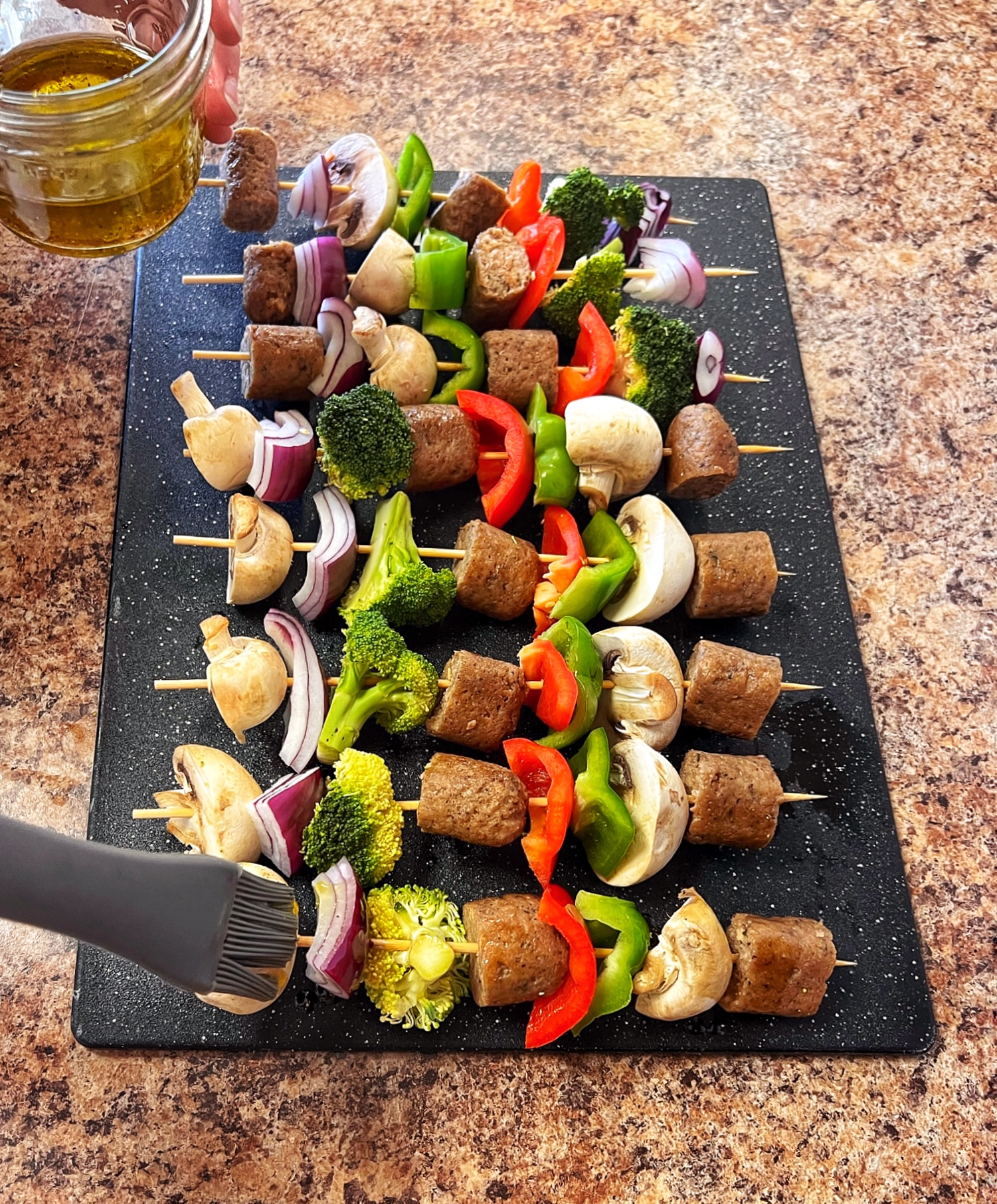 Oiling veggie kabobs